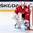 MINSK, BELARUS - MAY 16: Switzerland's Reto Berra #20 looks out from his goal during preliminary round action against Finland at the 2014 IIHF Ice Hockey World Championship. (Photo by Andre Ringuette/HHOF-IIHF Images)

